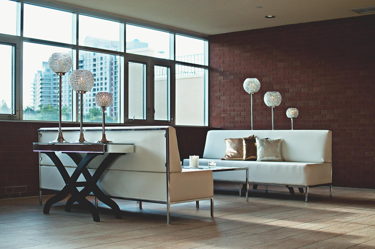 Luxury modern apartment interior with floor-to-ceiling windows and a Dubai city view