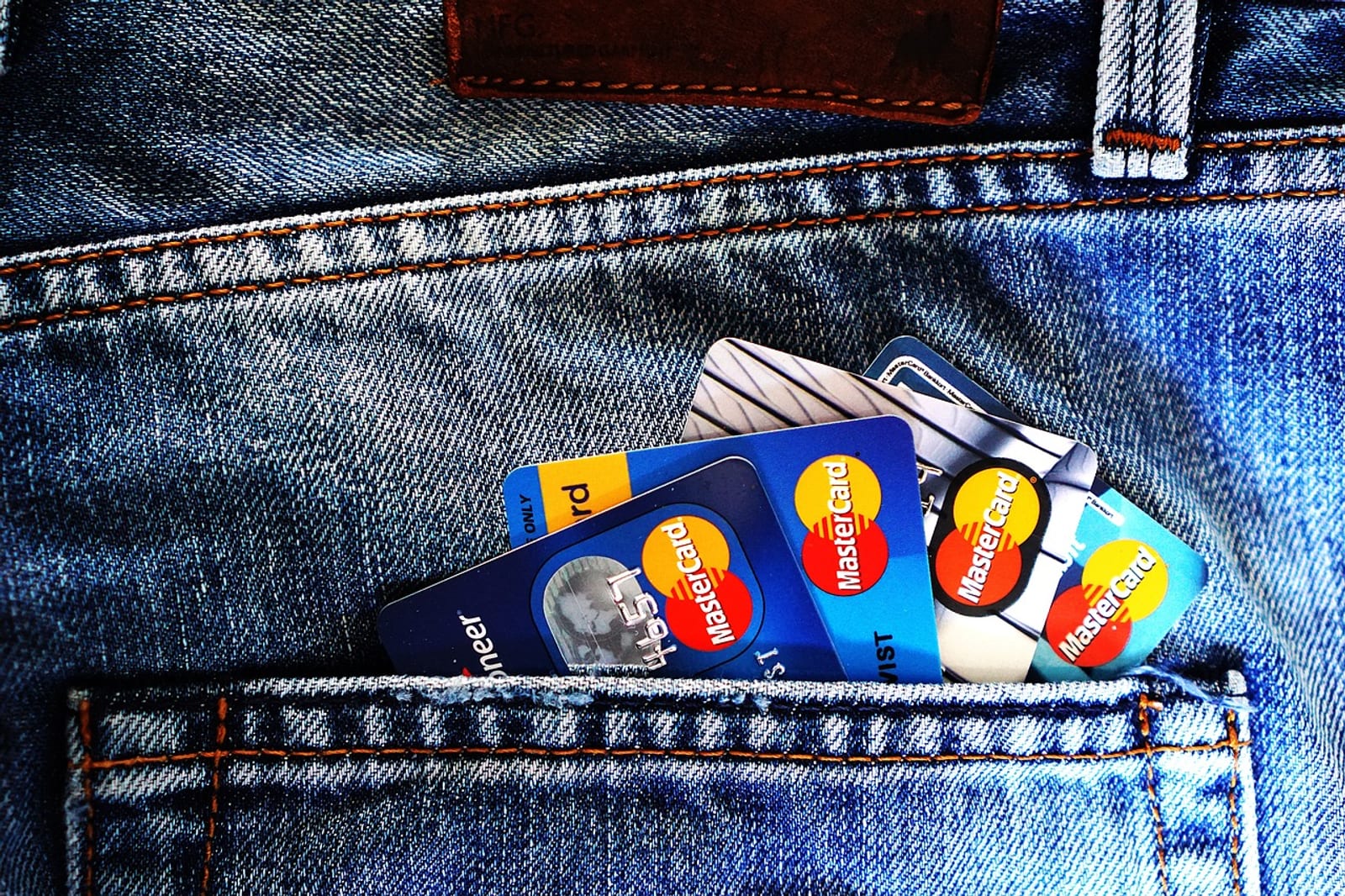 Person using a mobile banking app with a credit card