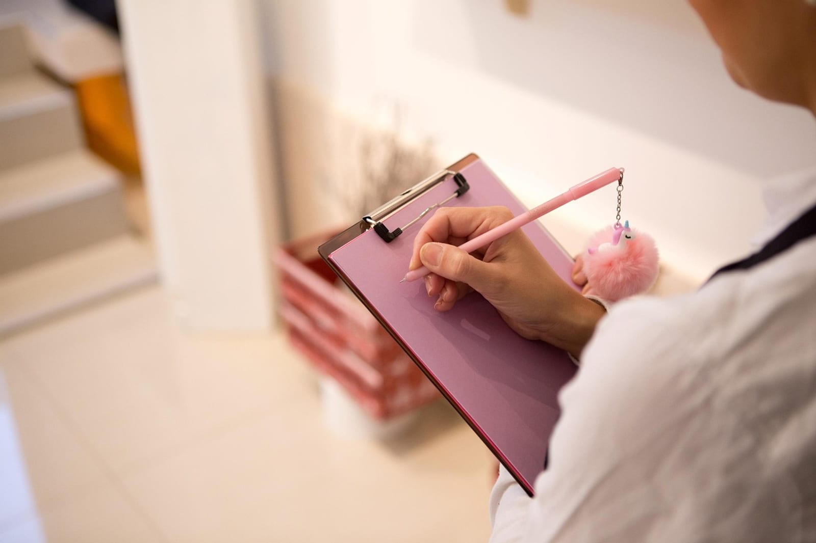 Clipboard checklist with moving boxes for relocation planning